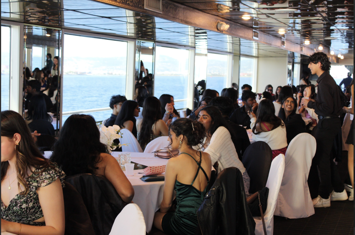 Cruise attendees gather on the dining deck before a night of dancing, karaoke, and great views.